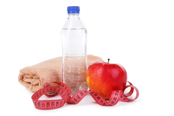 Manzana con cinta métrica y botella de agua — Foto de Stock