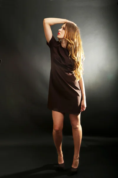 Beautiful girl in brown dress — Stock Photo, Image