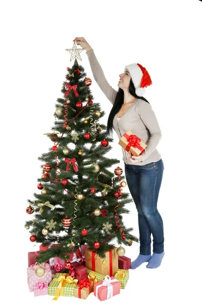 Woman decorating christmas tree — Stock Photo, Image