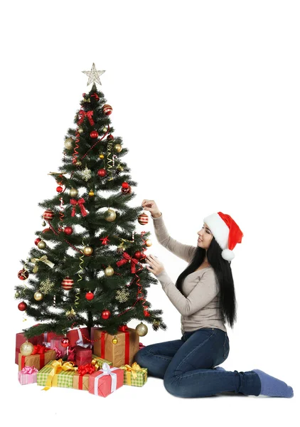Woman decorating christmas tree Stock Image