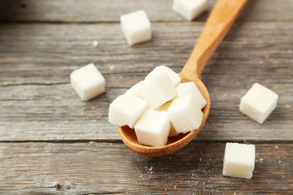 Sugar cube in spoon — Stock Photo, Image