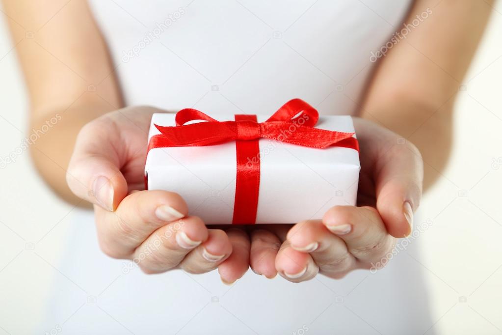 Hands holding gift box — Stock Photo © 5seconds 66639575