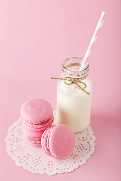 French macarons with bottle of milk — Stock Photo, Image