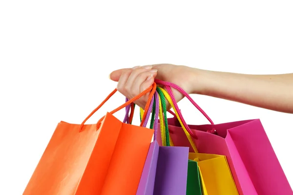 Mano celebración bolsas de compras — Foto de Stock