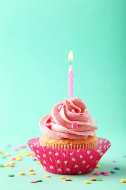 Tasty cupcake with candle clipart