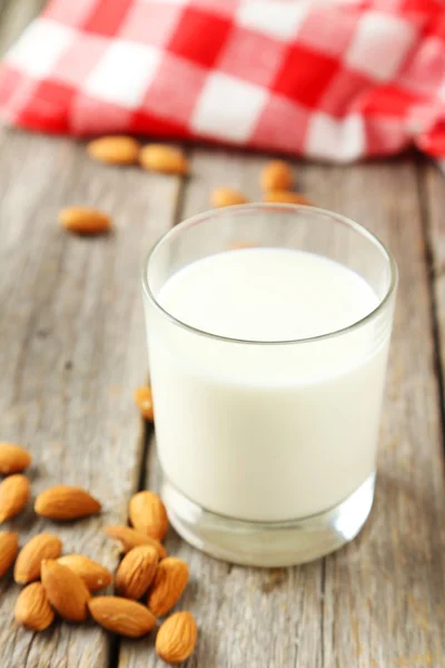 Glass of milk with almonds — Stock Photo, Image