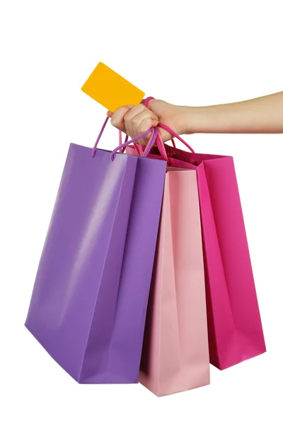 Mão segurando sacos de compras coloridos — Fotografia de Stock
