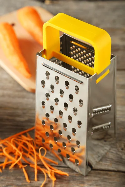 Metal grater and carrot — Stock Photo, Image