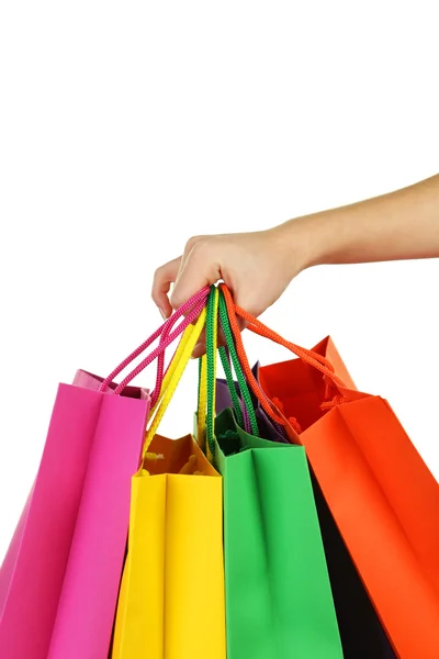 Hand holding colorful shopping bags — Stock Photo, Image