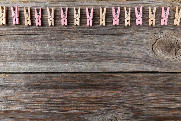 Wood clothespins on grey — Stock Photo, Image