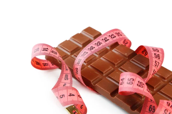 Cinta métrica con barra de chocolate con leche —  Fotos de Stock
