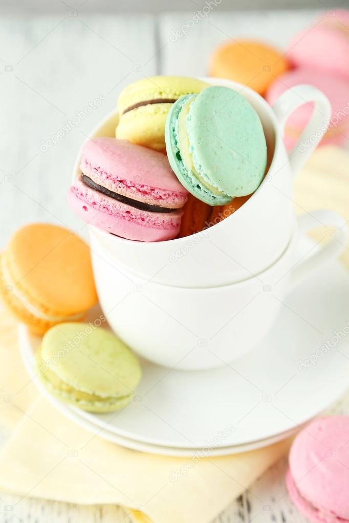 French colorful macarons in cup