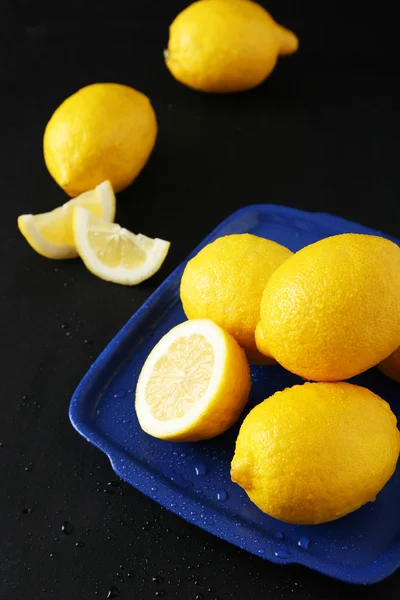 Lemons on black background — Stock Photo, Image