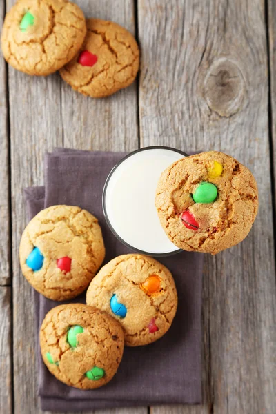 Cookies with colorful candies and milk — Stock Photo, Image