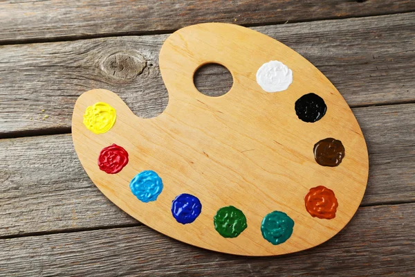 Wooden art palette with paints — Stock Photo, Image