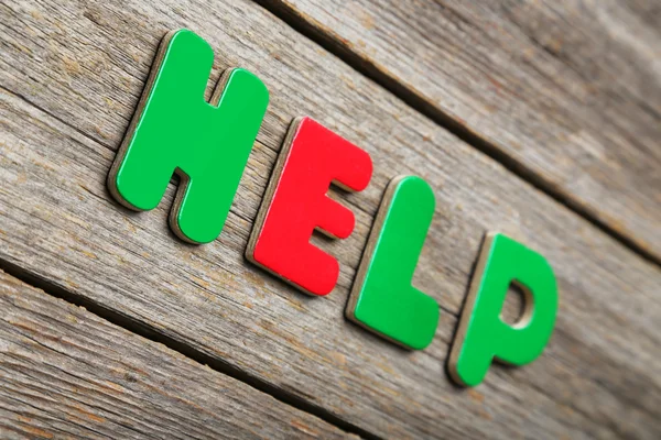 Help word made of colorful magnets — Stock Photo, Image