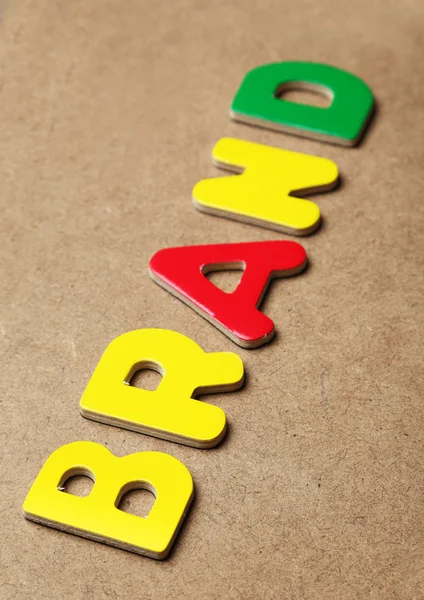Brand word made of colorful magnets — Stock Photo, Image