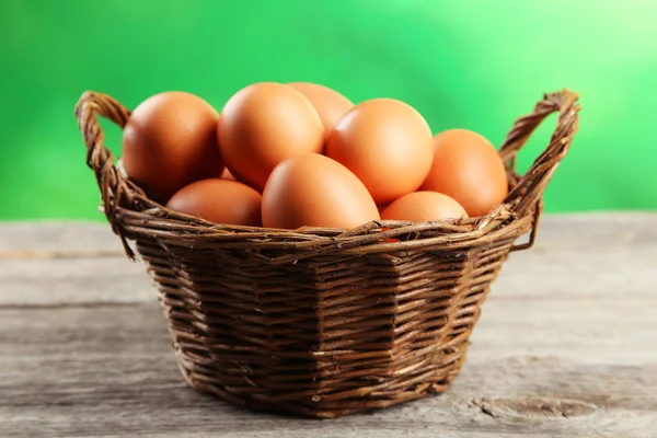 Chicken eggs in basket — Stock Photo, Image