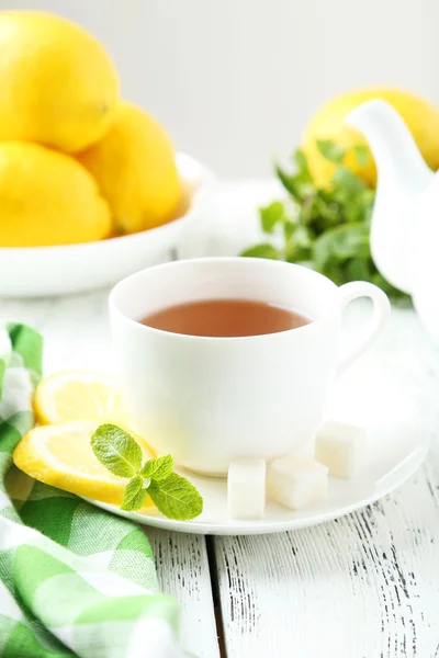 Cup of tea with mint and lemon — Stock Photo, Image