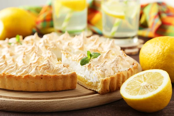 Lemon meringue pie on cutting board — Stock Photo, Image