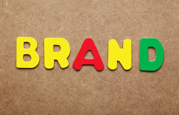 Brand word made of colorful magnets — Stock Photo, Image