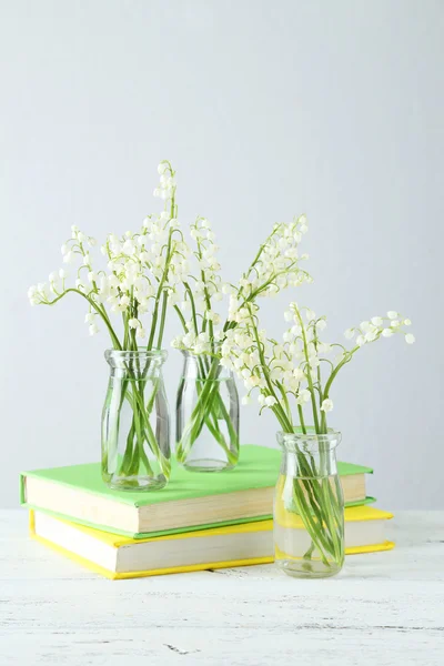 Lily of the Valley in bottles — Stock Photo, Image