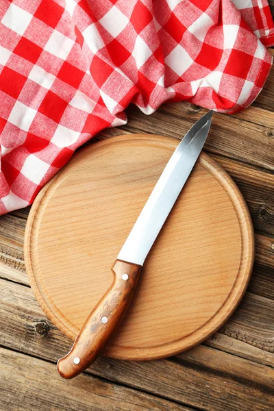 Kitchen knife on wooden board — Stock Photo, Image