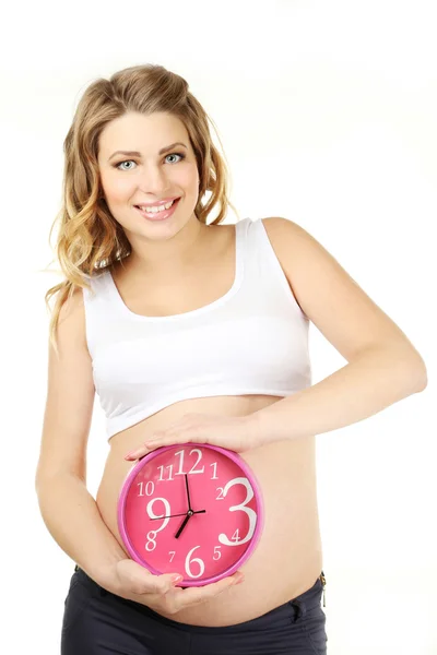 Pregnant with woman with clock Stock Photo