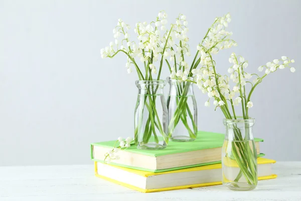 Lily of the Valley in bottles — Stock Photo, Image