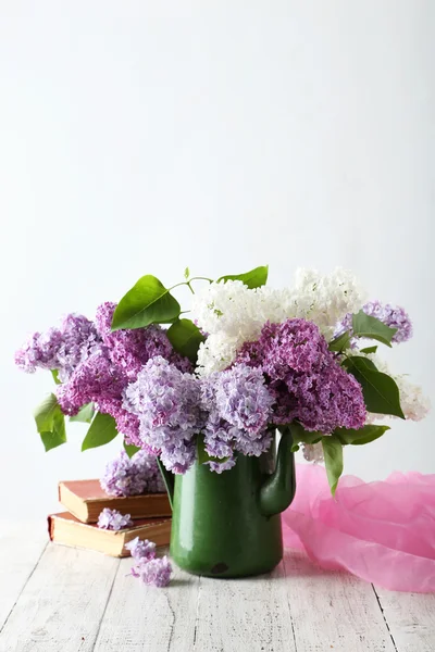 Beautiful lilac flowers  in pitcher — Stock Photo, Image