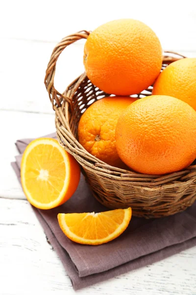 Ripe oranges in basket — Stock Photo, Image