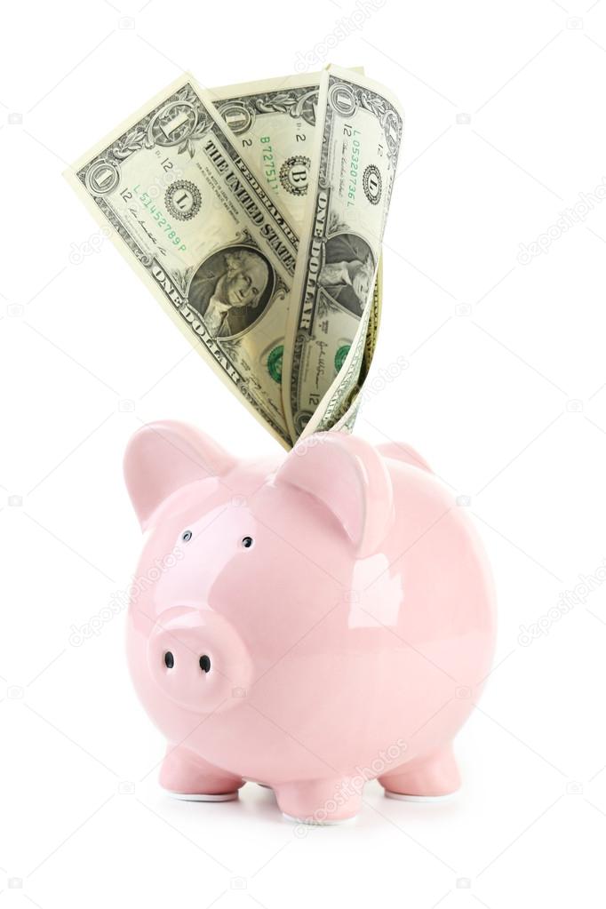 Pink piggy bank with dollars