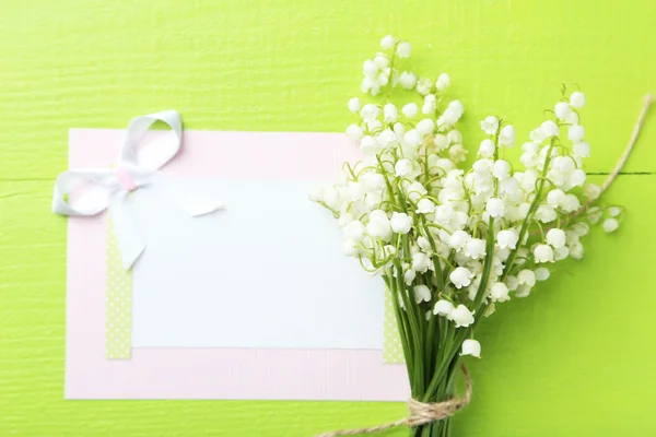 Lily of the Valley with card — Stock Photo, Image