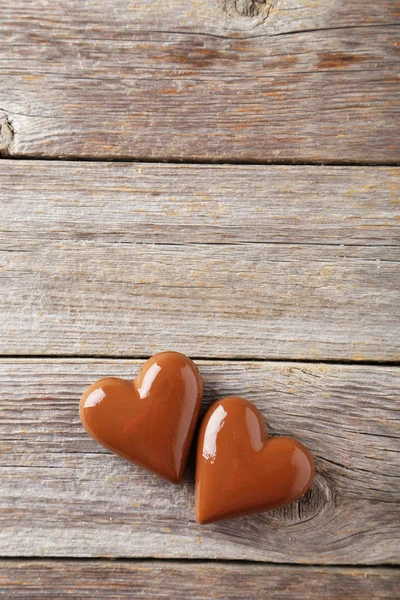 Chocolate hearts on grey — Stock Photo, Image