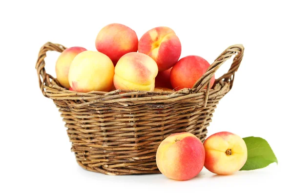 Fresh apricots in basket on a white background — Stock Photo, Image