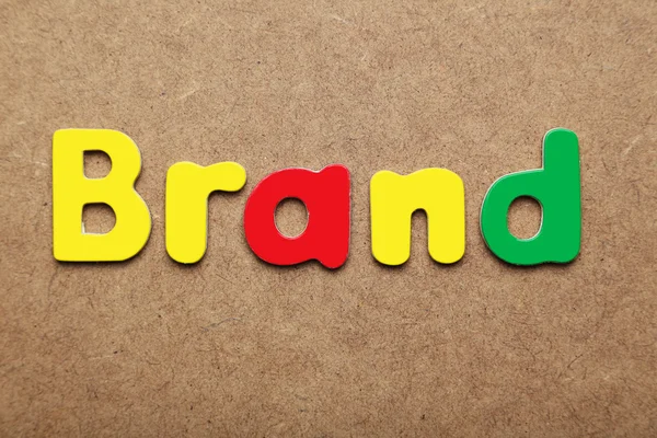 Brand word made of colorful magnets — Stock Photo, Image