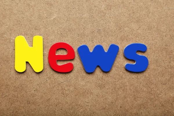 News word made of colorful magnets — Stockfoto