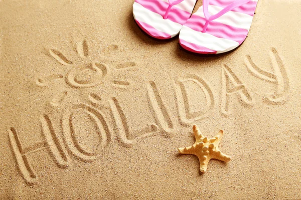 Holiday written in sand — Stok fotoğraf