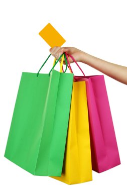 renkli alışveriş torbaları tutmak el
