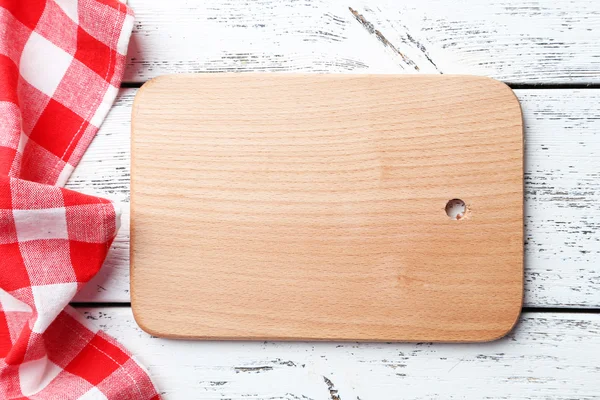 Mesa con tabla de cortar y servilleta —  Fotos de Stock