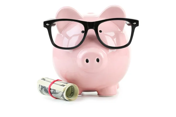 Růžové prasátko s brýlemi a dolary — Stock fotografie