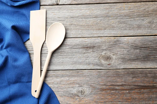 Wooden spoon and napkin on grey background — Φωτογραφία Αρχείου