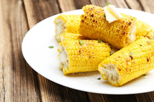 Fresh tasty grilled corns with butter — Stock Photo, Image