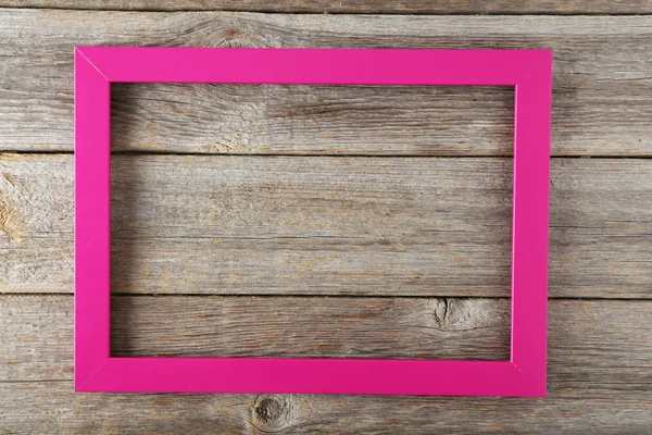 Деревянная рамка на деревянном фоне — стоковое фото
