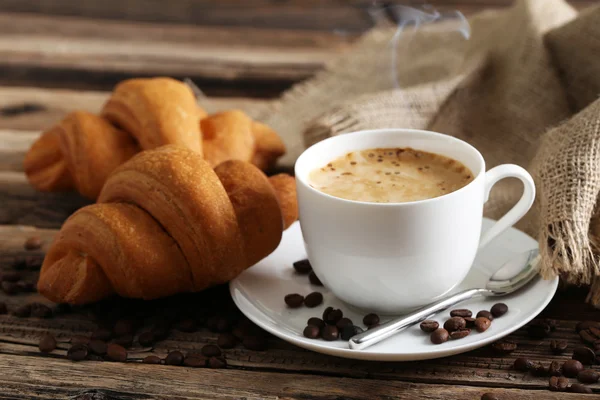 Delicious croissants with cup of coffee — Stock Photo, Image