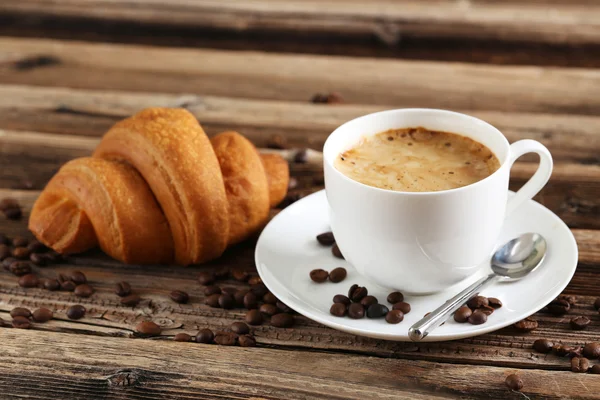 Delicious croissant with cup of coffee — Stock Photo, Image