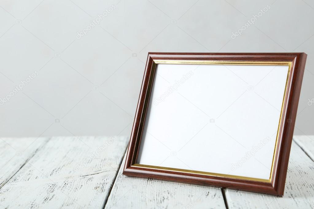 frame on white wooden background