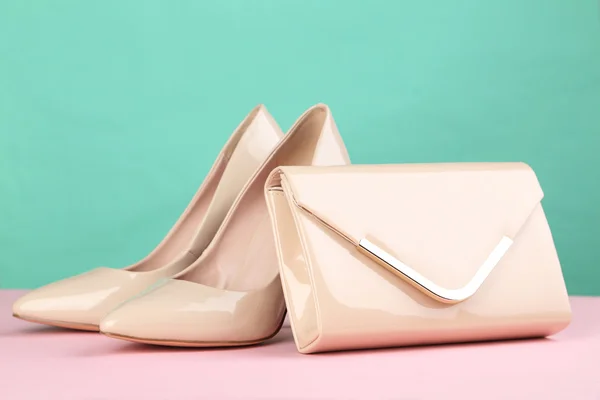 high-heeled shoes with handbag