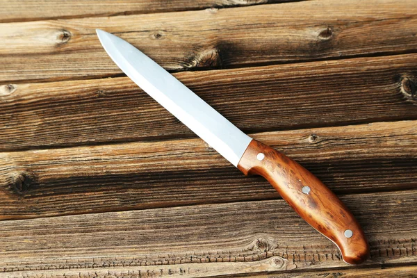Knife on wooden background — Stock Photo, Image