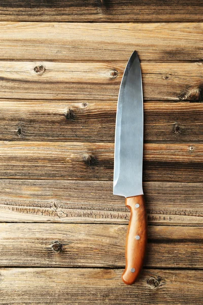 Kitchen knife on brown — Stock Photo, Image